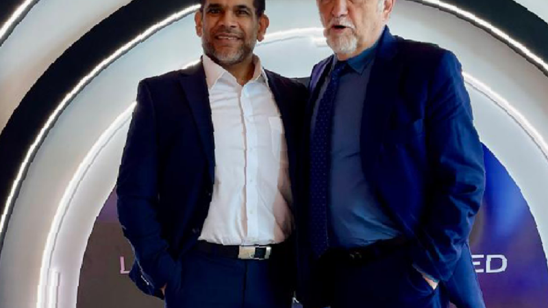Dr. Christopher Walker with a fellow medical professional at a regenerative medicine training event and conference setting