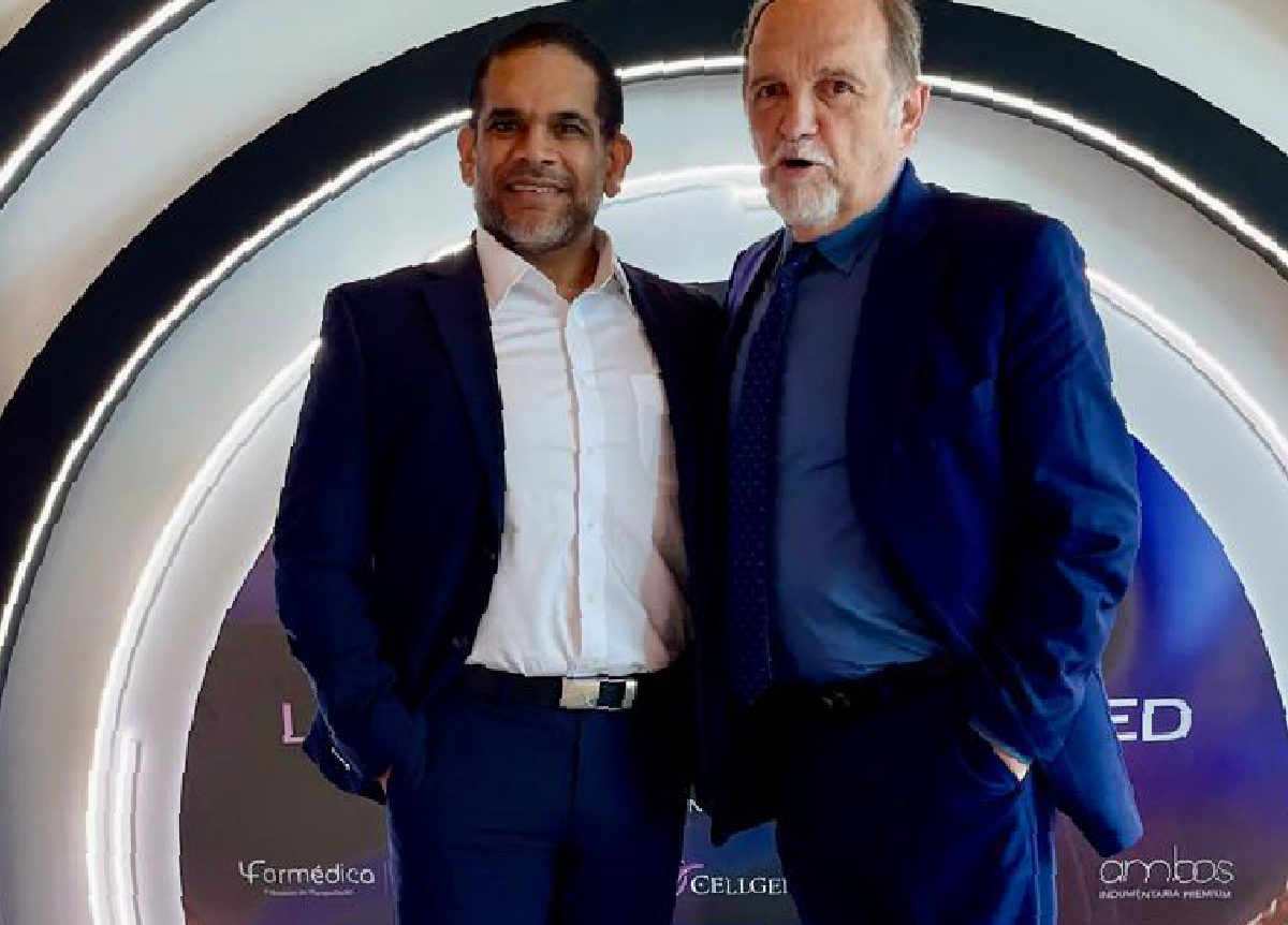 Dr. Christopher Walker with a fellow medical professional at a regenerative medicine training event and conference setting