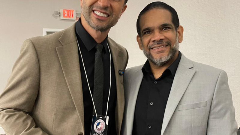 Dr. Christopher Walker with Dr. Diovane Ruaro, President of the ASCPS, during an international physician education and medical leadership event.