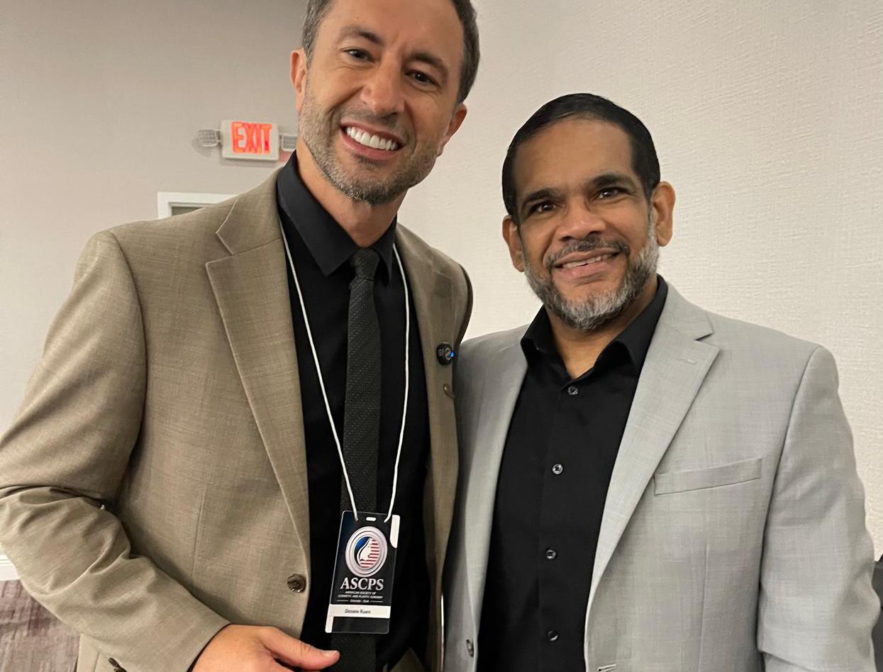 Dr. Christopher Walker with Dr. Diovane Ruaro, President of the ASCPS, during an international physician education and medical leadership event.