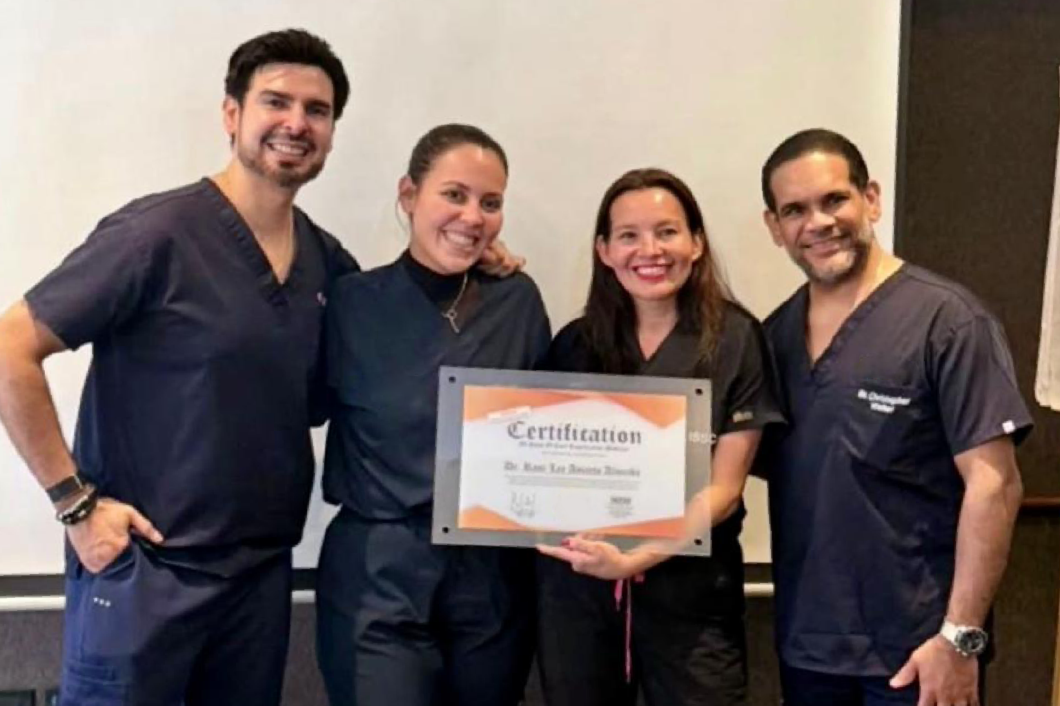 Medical professionals receiving certification during advanced physician training led by Dr. Christopher Walker in peptide medicine education