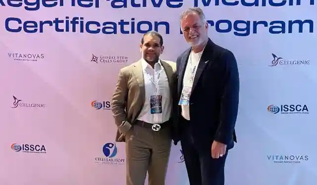 Dr. Christopher Walker attending an ISSCA Regenerative Medicine Certification Program alongside a fellow physician